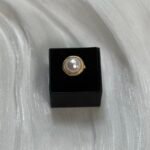 Golden-Rimmed Pearl Ring